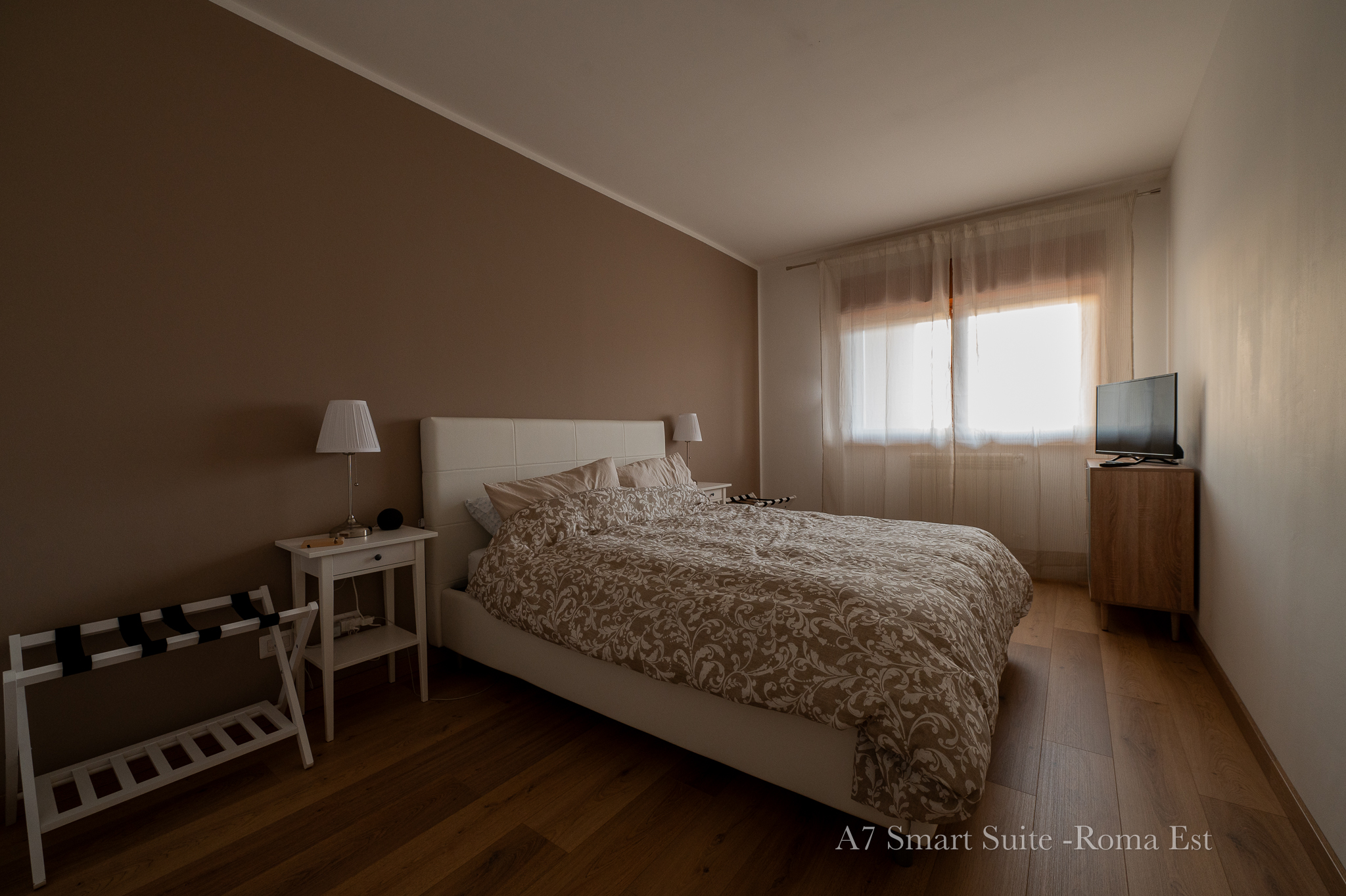 Camera da letto di A7 Smart Suite Roma Est, ampia e accogliente